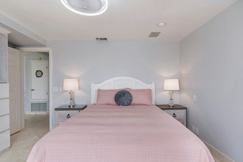 Queen Ground Floor Bedroom with Closet and TV Relax in style with a smart TV for quiet evenings and ample closet space for your belongings.
