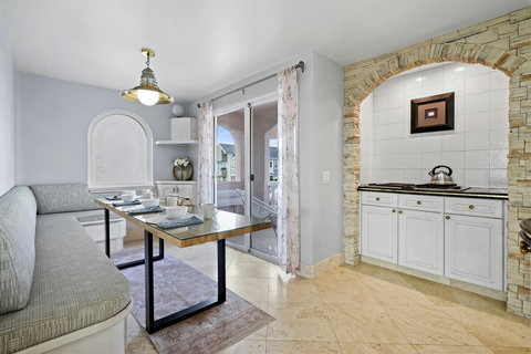 Kitchen Breakfast Nook This cozy nook is the perfect spot for casual meals or quiet moments with a book and a cup of tea.