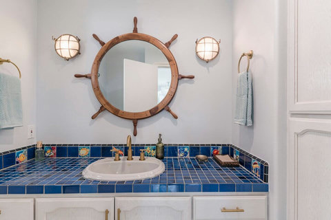 Main Floor Powder Room A convenient and stylish powder room for guests and family alike.