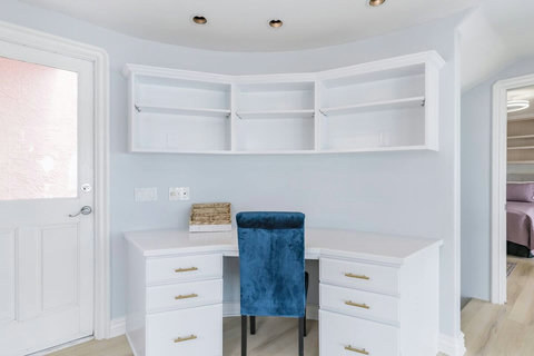 Desk Area with Door to Roof Deck Balance work and leisure with easy access to breathtaking views just outside the door.