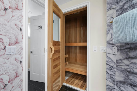 Cedar Dry Sauna Relax and rejuvenate in your private cedar sauna.  #50 The Roof Deck Has String Lights Over Lounge Furniture and Fire Pit Spend evenings under the stars, surrounded by cozy seating and the warmth of the fire pit.  #51 Seating for 8 wi