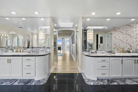 Luxurious Ensuite Bathroom on Third Floor Indulge in spa-like amenities, including a soaking tub and dual vanities.
