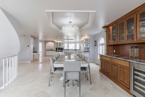 Dining for 10 with Leather Chairs, Glass-Top Table Host elegant dinners or casual brunches at this stylish dining table.