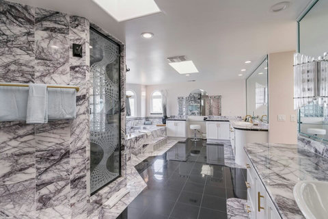 Pink and Lavender Marble Throughout Elegant marble details create a serene and sophisticated ambiance.