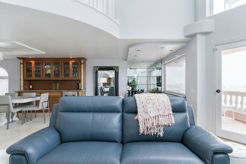Blue leather lounge furniture with electric reclining.