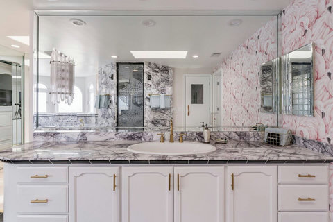His Side of the Master Bathroom Designed with functionality and style in mind for a seamless stay.