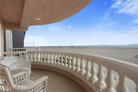 Just Behind the Bar is the Balcony with Ocean View Step outside to feel the sea breeze and enjoy panoramic views of the coastline.