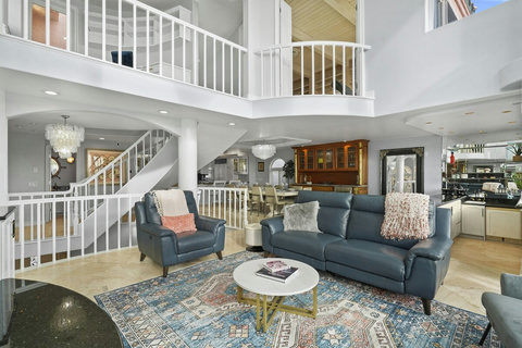 Blue Leather Reclining Couches and Velvet Accent Chairs Sink into luxurious comfort and enjoy movie nights or quiet evenings by the fire.