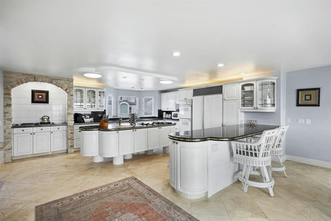 Chef’s Kitchen on the Second Floor Calling all food lovers! Create gourmet meals in this high-end kitchen, fully equipped with premium appliances and ample counter space.