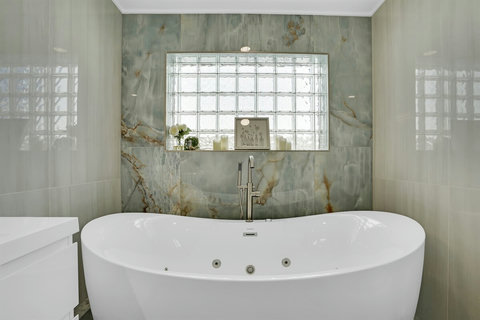 Ensuite bath with soaking tub and full shower—spa vibes included.