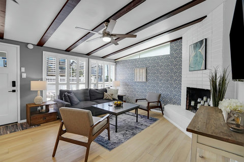 Relax in the living room with peek-a-boo water views, a smart TV, and a comfy sleeper sofa—perfect for movie nights and extra guests.