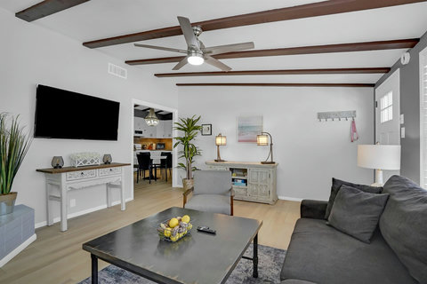 Relax in the living room with peek-a-boo water views, a smart TV, and a comfy sleeper sofa—perfect for movie nights and extra guests.
