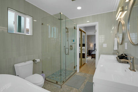 Ensuite bath with soaking tub and full shower—spa vibes included.