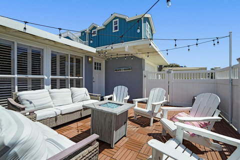 Ocean view alert! Chic Surf Shack brings you just close enough to see the waves from your private beach house patio.