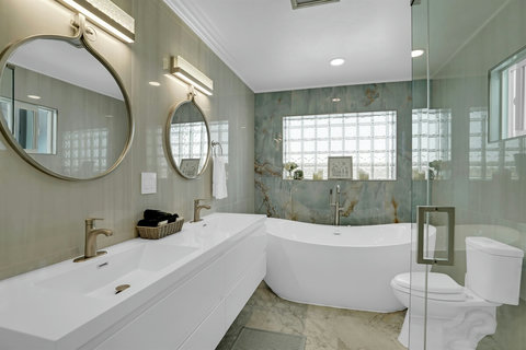 Ensuite bath with soaking tub and full shower—spa vibes included.