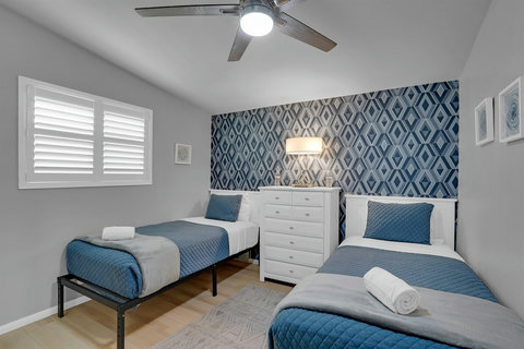 Two twin beds in a cheerful room—perfect for kids, cousins, or friends traveling together.