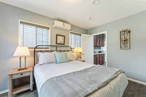 Queen Bedroom Enjoy a restful night in the queen bedroom with a Smart TV, closet, and even a cozy fireplace for added charm.