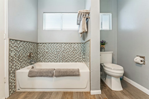 Modern Bathroom Clean and functional bathrooms with everything you need after a day at the beach—plus extra towels included!