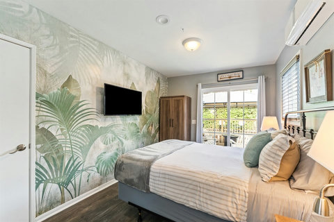 Queen Bedroom Enjoy a restful night in the queen bedroom with a Smart TV, closet, and even a cozy fireplace for added charm.