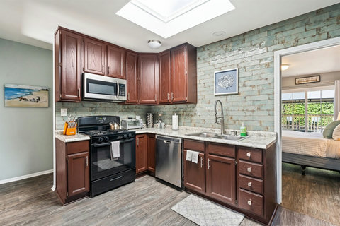 Kitchen Essentials Whip up meals with ease in a fully stocked kitchen—pots, pans, dishes, and a spice rack are all here to inspire your inner chef.