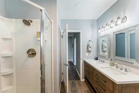 Modern Bathroom Clean and functional bathrooms with everything you need after a day at the beach—plus extra towels included!