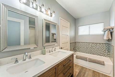 Modern Bathroom Clean and functional bathrooms with everything you need after a day at the beach—plus extra towels included!