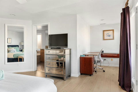 Spacious king bedroom with ensuite bathroom and natural light