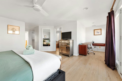 Spacious king bedroom with ensuite bathroom and natural light