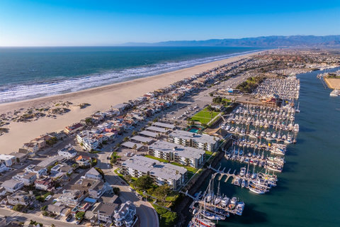 You are at the far end of the peninsula, withe the beach on one side and the marina on the other
