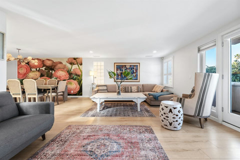 Bright, welcoming living spaces with beachy vibes throughout