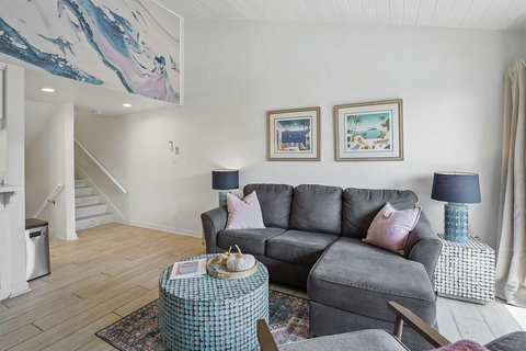 Cozy living room with sleeper sofa, open concept dining, fireplace and ocean view!