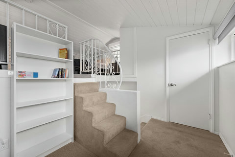 Ascend into the Queen Loft for a private, cozy space