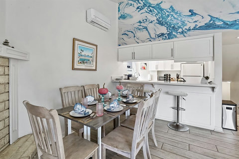 This isn't just a home; it's a hub for family and friends to come together. With plenty of inviting spaces, there's room for everyone to hang out and mingle. Extra chairs are always at the ready for when guests drop by.