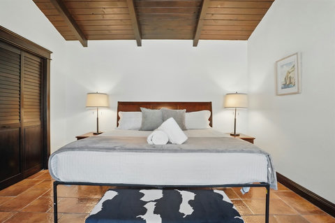 Upper King Bedroom with sliding door to the wrap-around balcony
