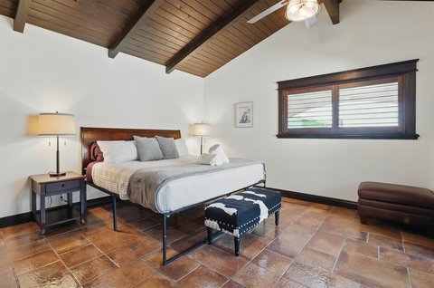 Upper King Bedroom with sliding door to the wrap-around balcony