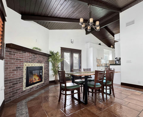 Dining area in open-concept living space, fireplace