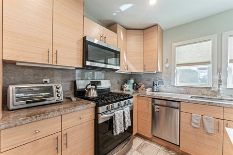 Kitchen with Breakfast Bar Perfect for morning coffee or casual bites, the breakfast bar adds extra space to gather and connect.