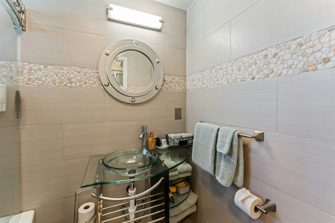 Full Ensuite Bathroom with Tub/Shower Soak or rinse off in your private full bath, featuring a clean tub/shower combo.