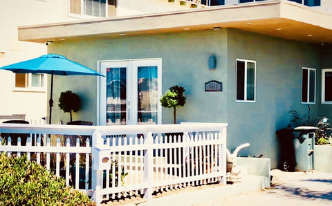 Outdoor Retreat: Enjoy sunny mornings under the umbrella on your private patio with water views!