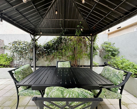 Back Patio Dining Under the Lights Enjoy dinner al fresco under the gazebo with twinkling string lights—perfect for warm nights and easy outdoor entertaining.