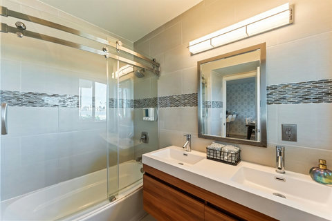 Guest-Friendly Main Bathroom Clean and convenient, this bathroom is centrally located for easy access.