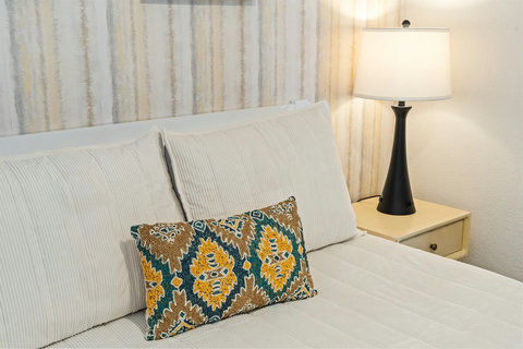 Second Floor Queen Bedroom – Updated, peaceful, and ready to help you unwind after a beach day.