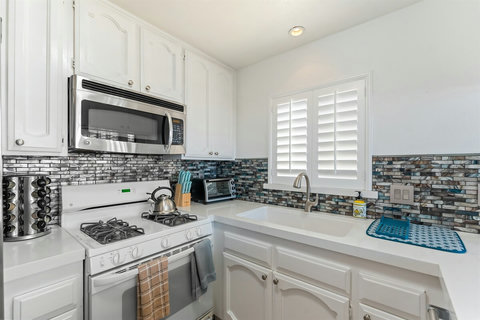 Spacious, fully stocked kitchen with everything you need—cookware, condiments, and a coffee station included!