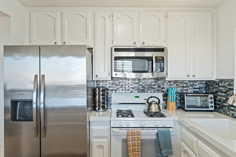 Spacious, fully stocked kitchen with everything you need—cookware, condiments, and a coffee station included!