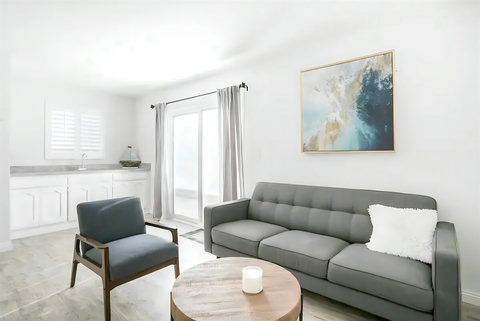 Ground Floor Living Room – Light-filled and welcoming, with space to lounge, read, or stream your favorite shows.