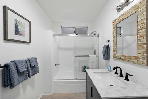 Your Private Spa Retreat: Enjoy a Full Bathroom with Shower/Tub, Vanity Decked with Hotel-Quality Towels, Toiletries, and a Hair Dryer for a Luxurious Stay!