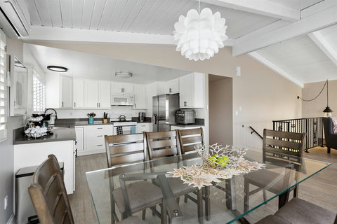 Kitchen Excellence: Experience the Joy of Cooking in Our Spacious, Fully Loaded Kitchen, Complete with Spice and Knife Racks, Cookware Galore, and a Convenient Coffee Bar.