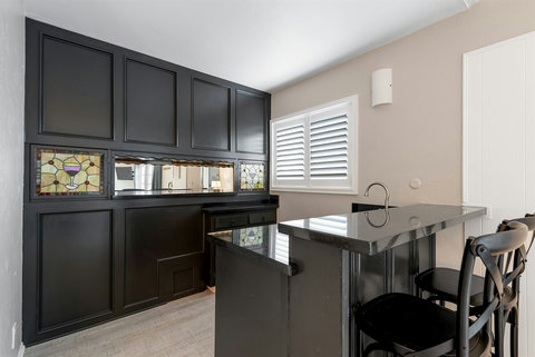Family Bonding Space: Relax in Our Ground-Floor Second Family Room with a Sofa Sleeper, 50" Smart TV, and a Delightful Coffee Bar