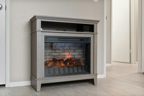 Your Home Away from Home: Relax in a Room with Two Twin Beds, Hotel-Style Linens, a Closet, and a Cozy Electric Fireplace