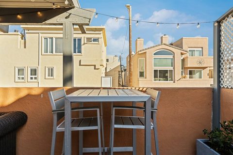 Rear Patio Step out onto the spacious rear patio, where you'll find lounge seating, a dining table, and a BBQ grill perfect for outdoor gatherings and late-night s'mores by the firepit.